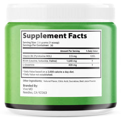 VIVE MD Tonic Greens scoop on a surface, convenient measure for daily supplementation.