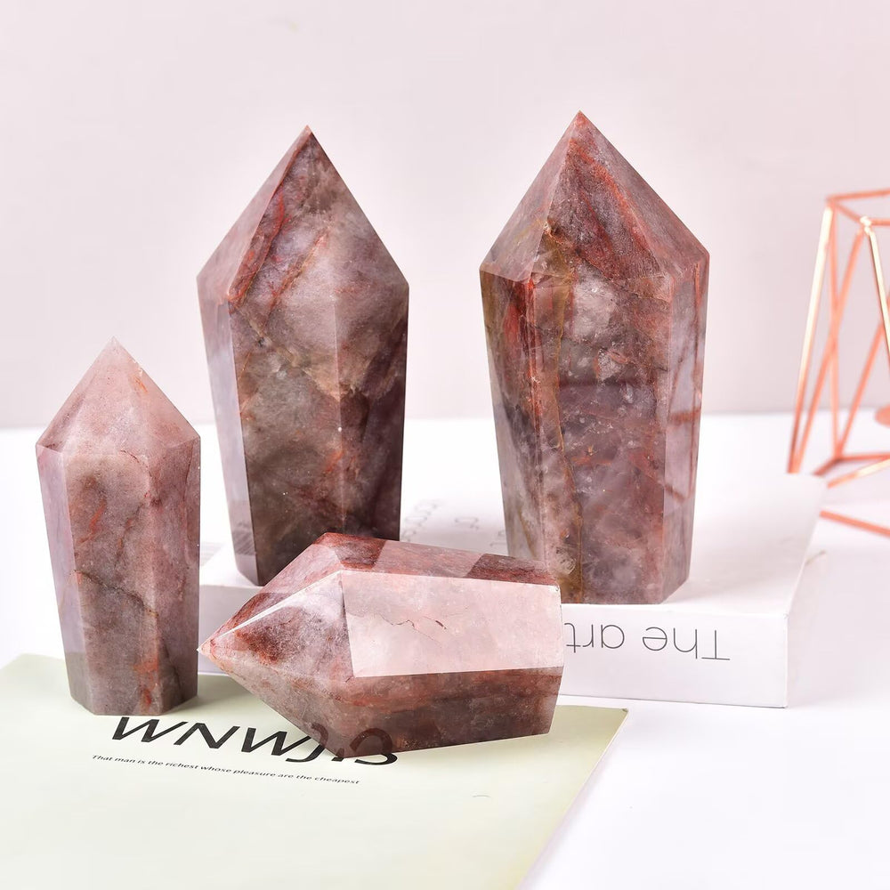 Vizytou hematoid quartz obelisk promotes a calm, tranquil environment.