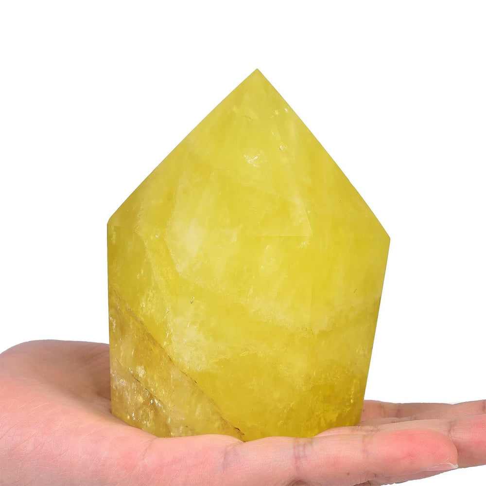 Vizytou lemon quartz wand close-up highlights facets for meditation focus.