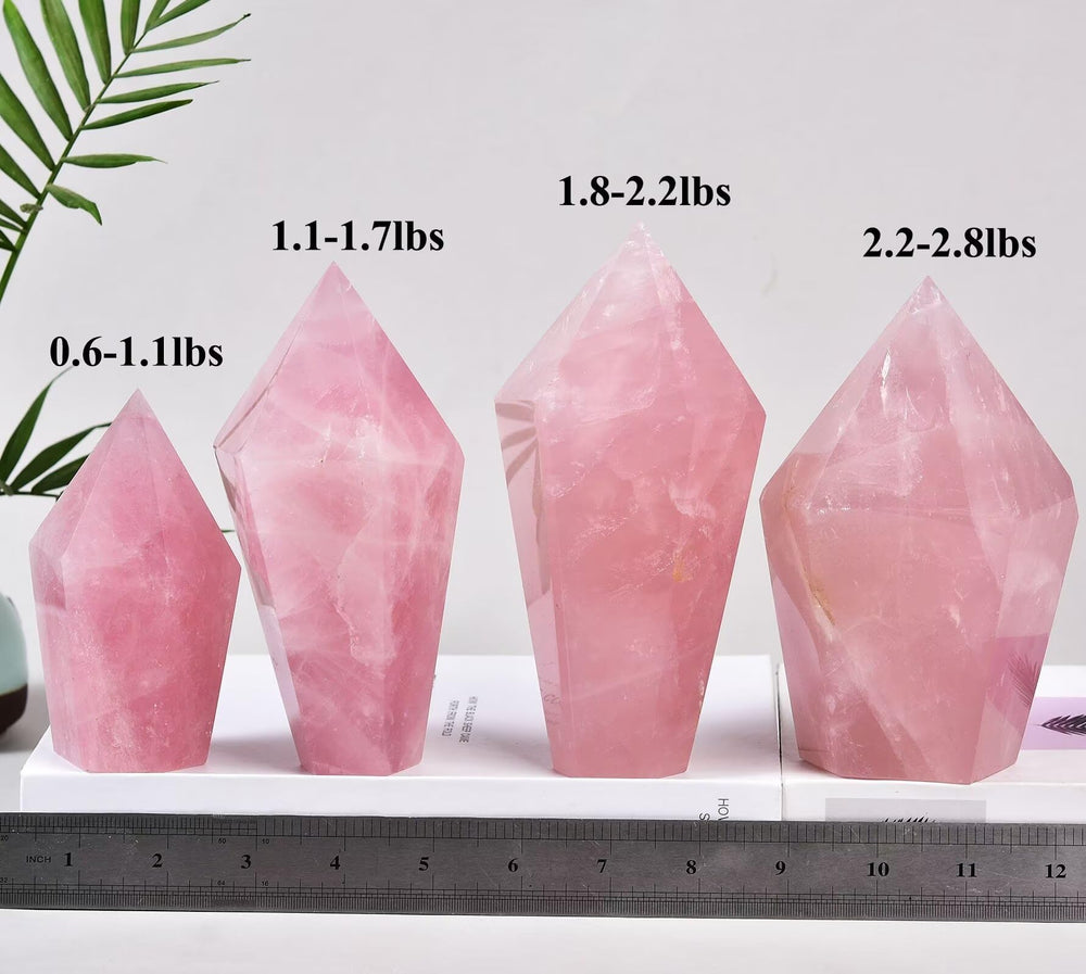 Closeup of VIZYTOU rose quartz obelisk showing natural color and facets.