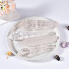 VIZYTOU white crystal wand in hand supports energy work and personal reflection.