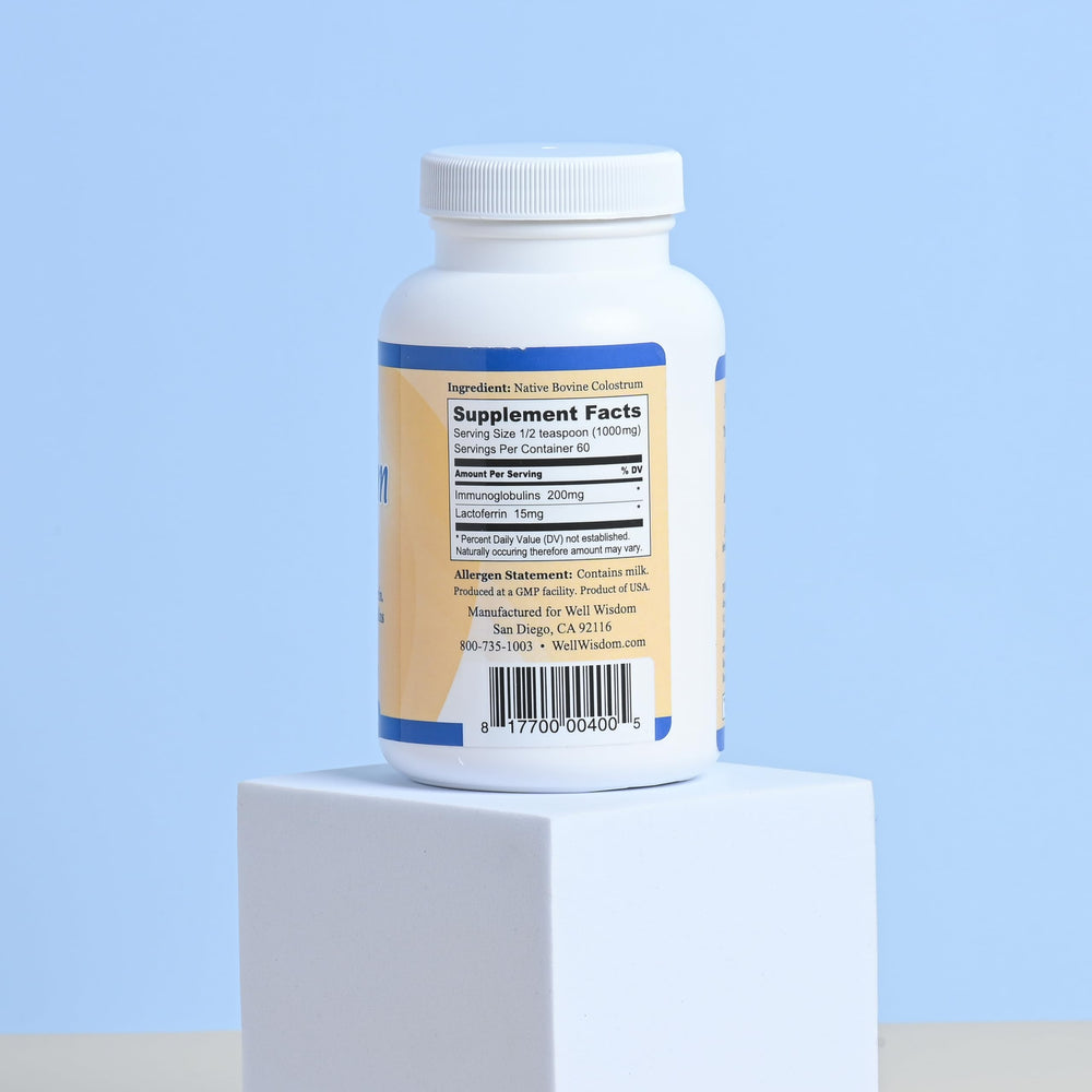 Well Wisdom Grass-fed Colostrum powder bag opened for easy daily mixing.
