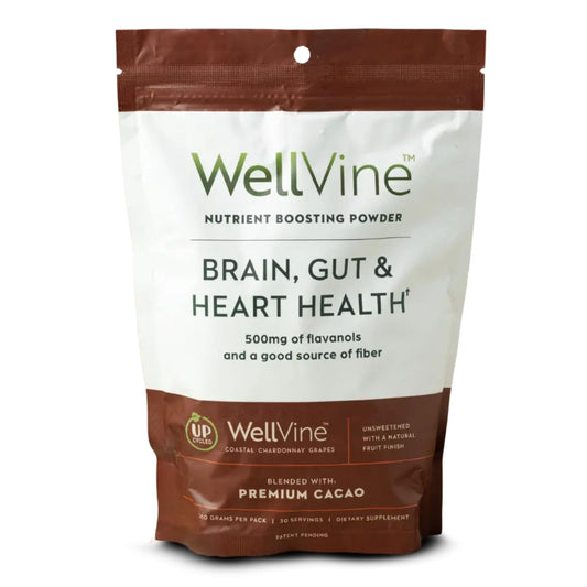 WellVine Nutrition Boosting Blend bottle on a kitchen counter for daily plant‑based nutrition.