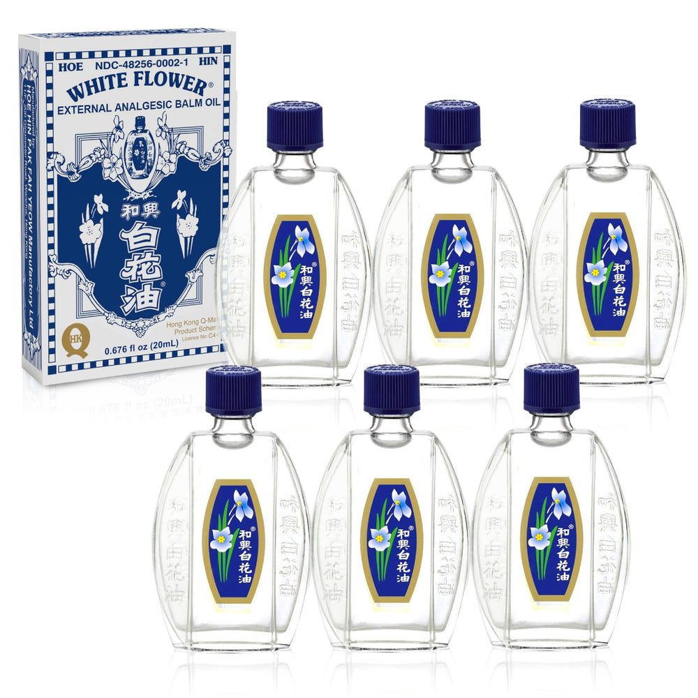 White Flower Balm Oil bottle pour for easy on-the-go application.