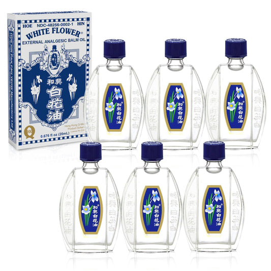 White Flower Balm Oil bottle pour for easy on-the-go application.