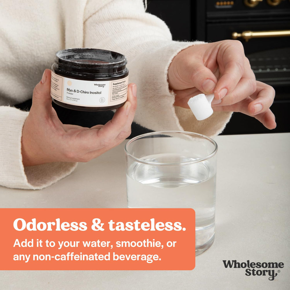 Wholesome Story powder poured into a cup, ready to mix a serving.