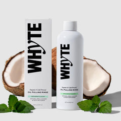 Whyte coconut oil pulling mouthwash bottle showcasing spearmint freshness for daily breath refreshment.