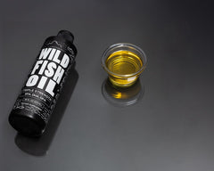 Daily serving concept with a teaspoon of Wild Foods Omega-3 Lemon