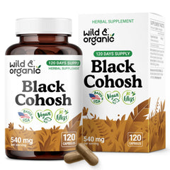 Wild & Organic Black Cohosh capsules bottle on wood, vegan and non-GMO menopause support.