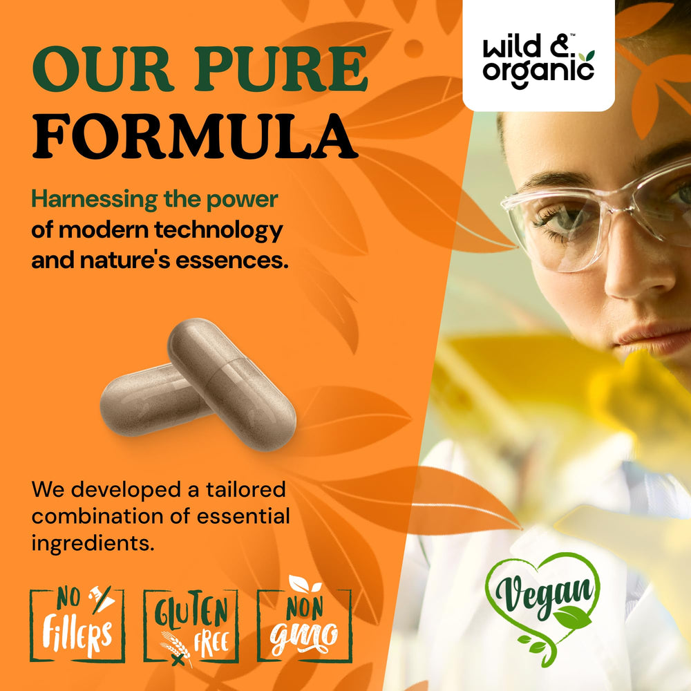 Wild and Organic immune mushroom capsules in hand for on-the-go boost.