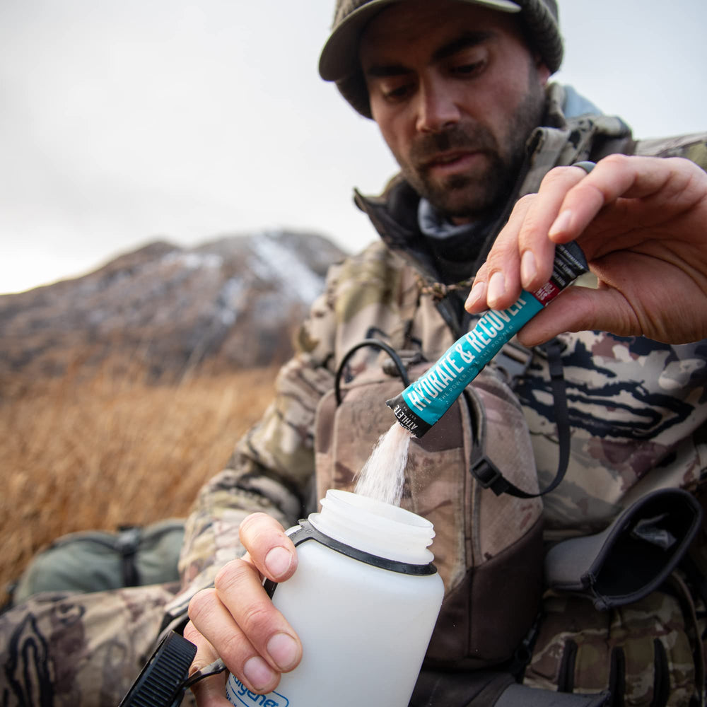Open pouch showing Wilderness Athlete Hydrate packets for daily hydration.