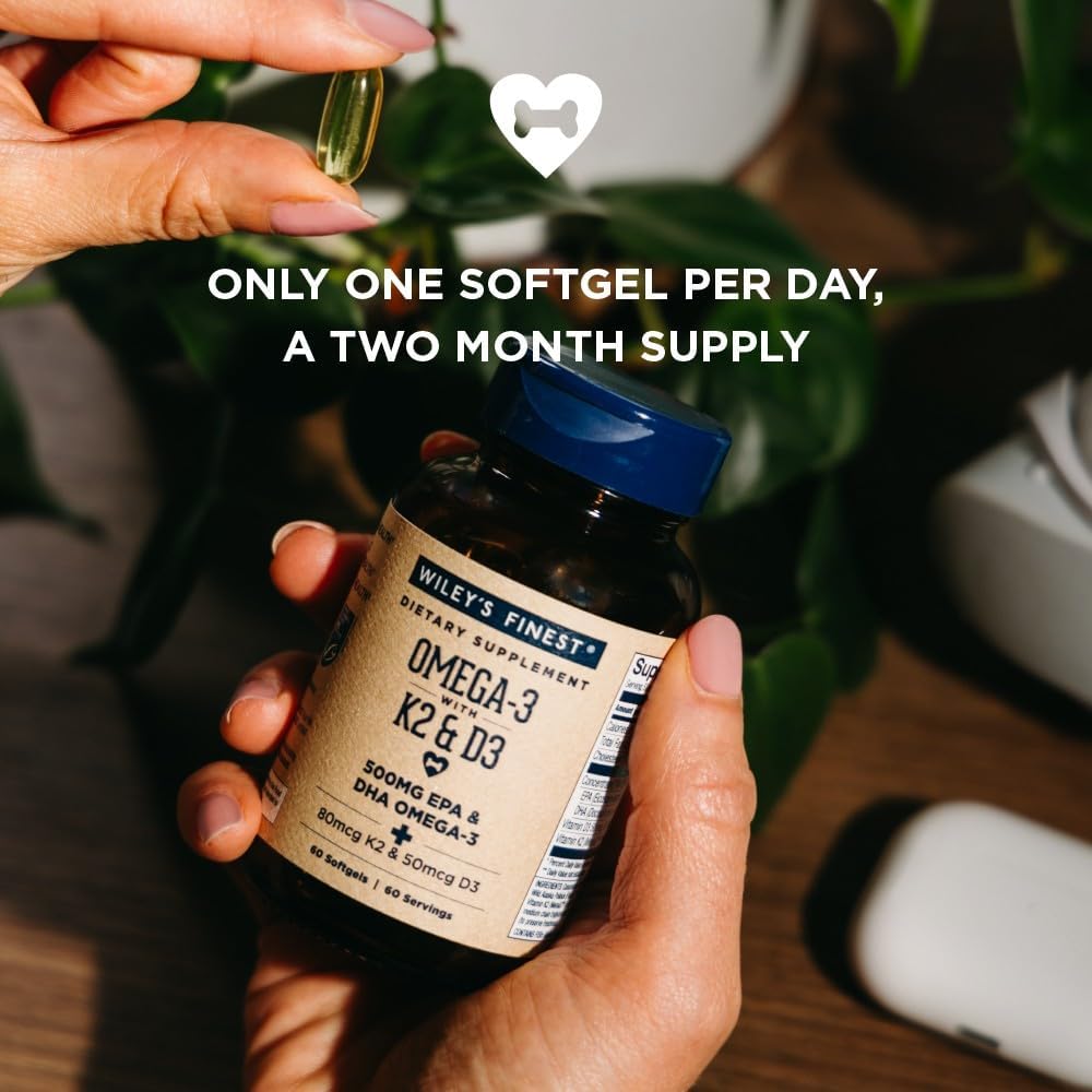 Wiley's Finest softgels in hand illustrate easy daily supplementation