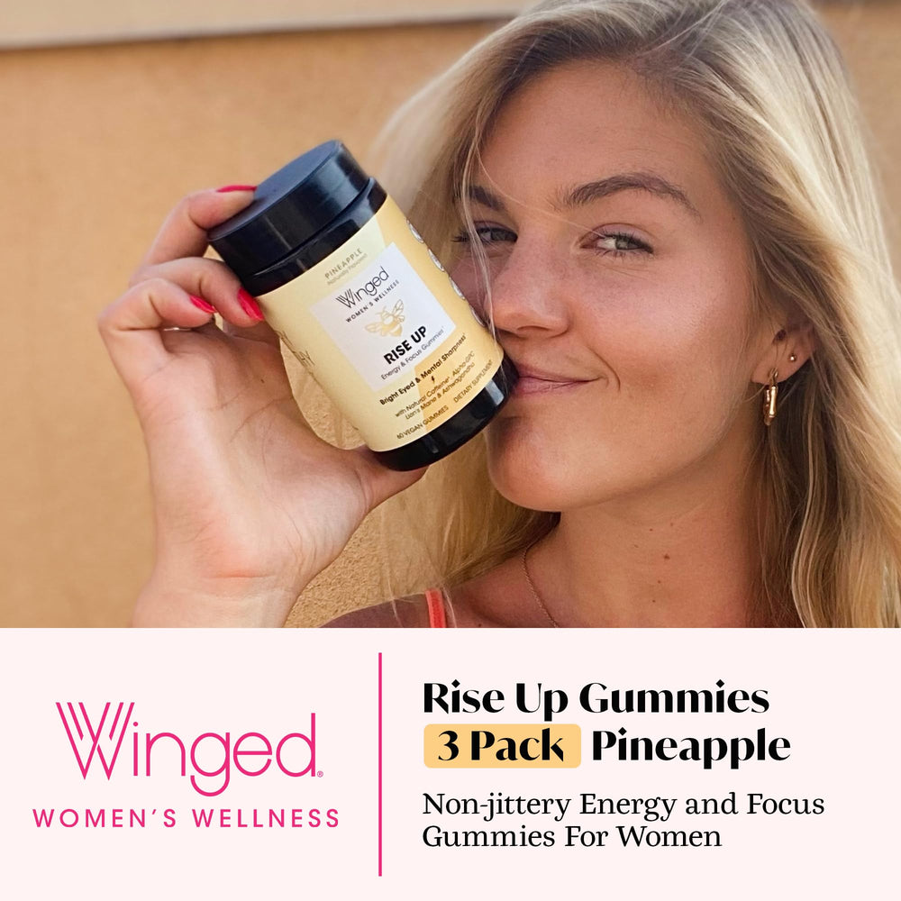Winged Wellness Rise Up gummies poured, showcasing texture and pineapple flavor for focus.