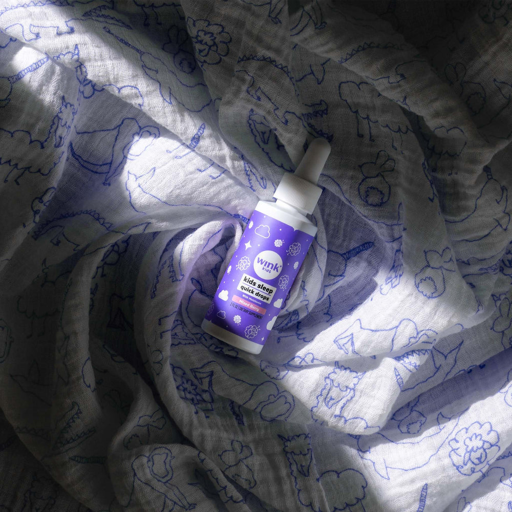 Wink Naturals WinkWell Kids Melatonin packaging on a nightstand