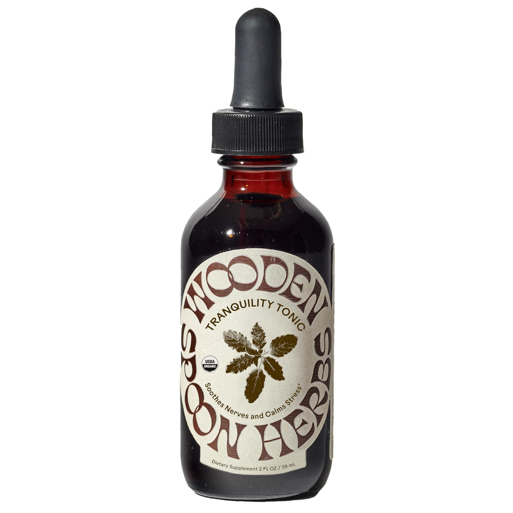 Wooden Spoon Herbs Tranquility Tonic bottle showing organic six-herb blend for calm.