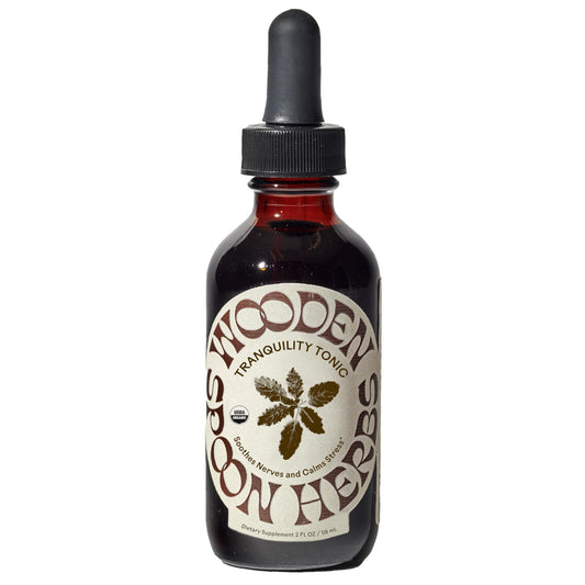 Wooden Spoon Herbs Tranquility Tonic bottle showing organic six-herb blend for calm.