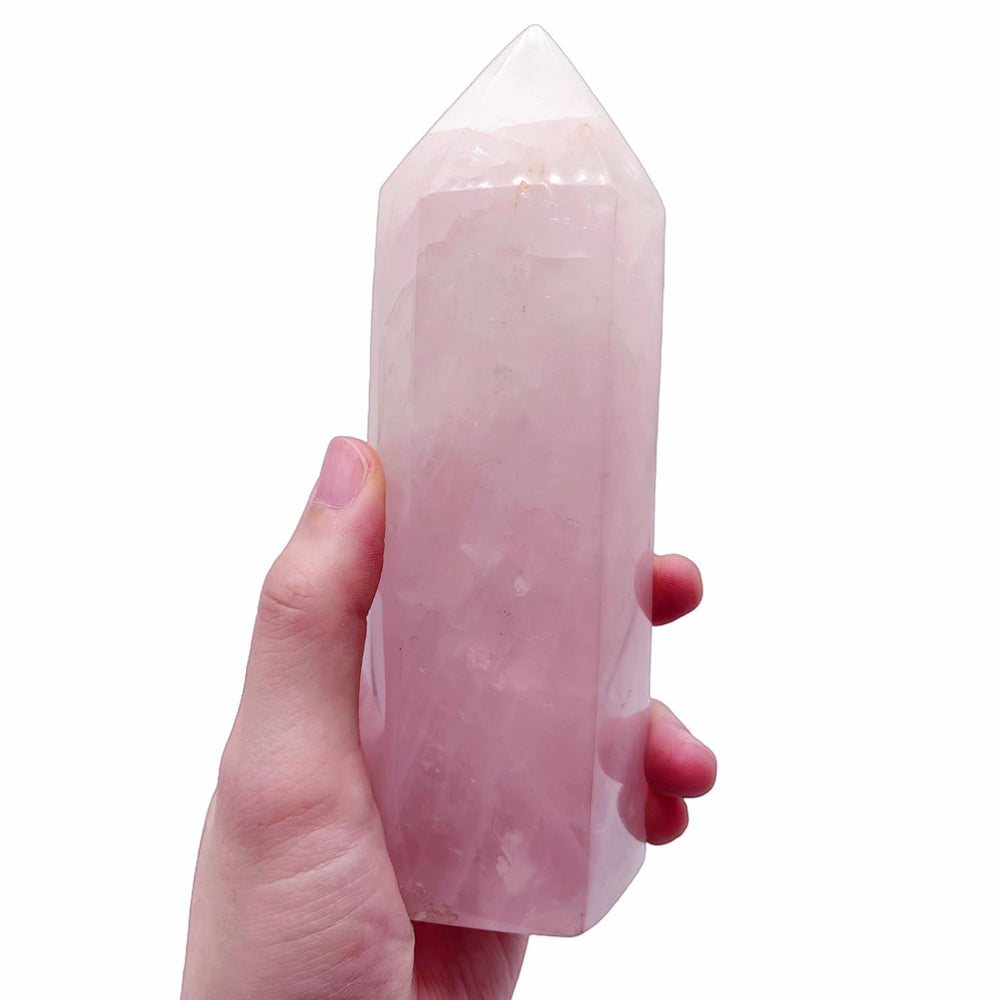 XMHOME rose quartz tower side view shows unique variations, enhancing tranquil decor.