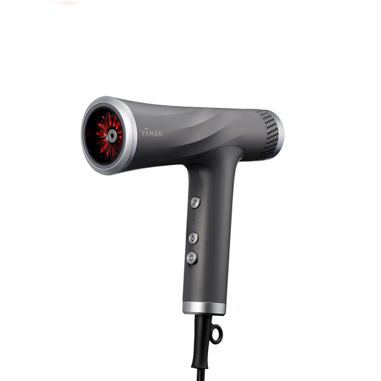 YA-MAN blow dryer with scalp massage attachment demonstrates soothing scalp care during styling