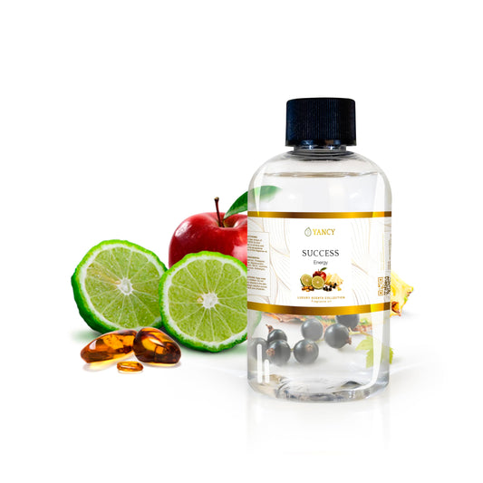 YANCY Success fragrance oil bottle beside a diffuser to boost focus and energy.
