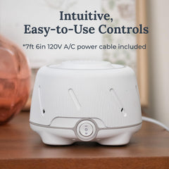 Yogasleep Dohm bedroom setup shows cozy sleep space with natural white noise.