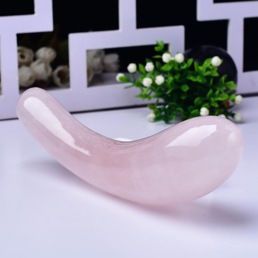 YOUNAIERZX rose quartz wand for facial massage use, showcasing translucent pink hue.