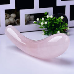 YOUNAIERZX rose quartz wand for facial massage use, showcasing translucent pink hue.
