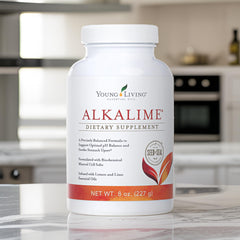 Young Living AlkaLime glass with drink, ready for on-the-go wellness.