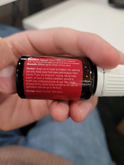 Young Living Bergamot bottle beside a spa-like setup highlighting Seed to Seal quality.