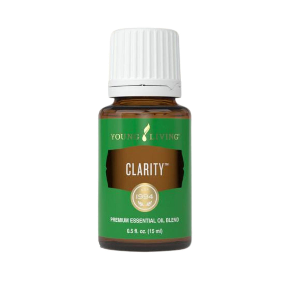 Young Living Clarity bottle being poured for diffusion and topical use for focus.