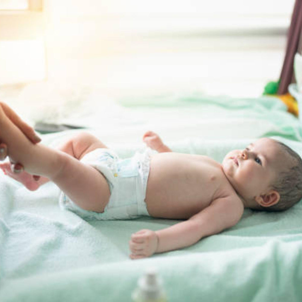 Young Living Gentle Baby baby massage scene with calming fragrance.