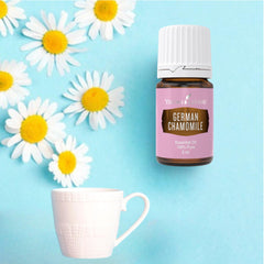 Pour action of Young Living German Chamomile 5ml bottle for easy topical use