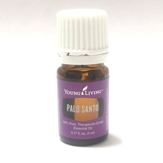 Young Living Palo Santo essential oil bottle with woodsy aroma for grounding rituals.