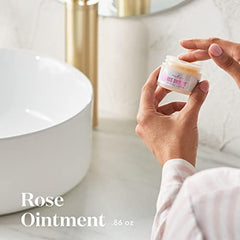 Rose Ointment cream texture ready for gentle application on dry areas.