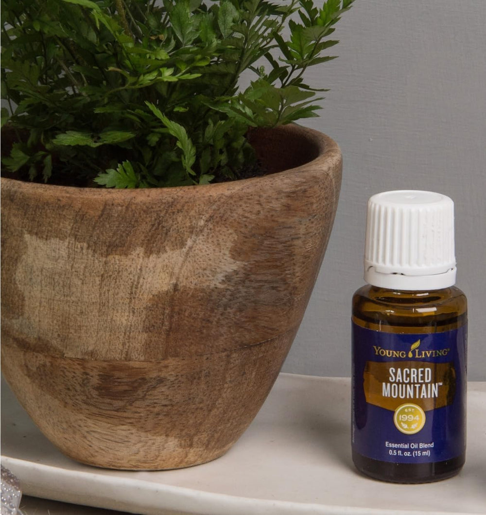 Young Living Sacred Mountain topical-application demonstrates easy daily grounding with oil.