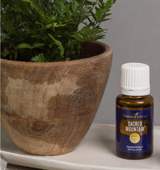Young Living Sacred Mountain topical-application demonstrates easy daily grounding with oil.