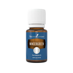 Young Living Wintergreen bottle pour showcases a refreshing, minty aroma perfect for soothing massage sessions.
