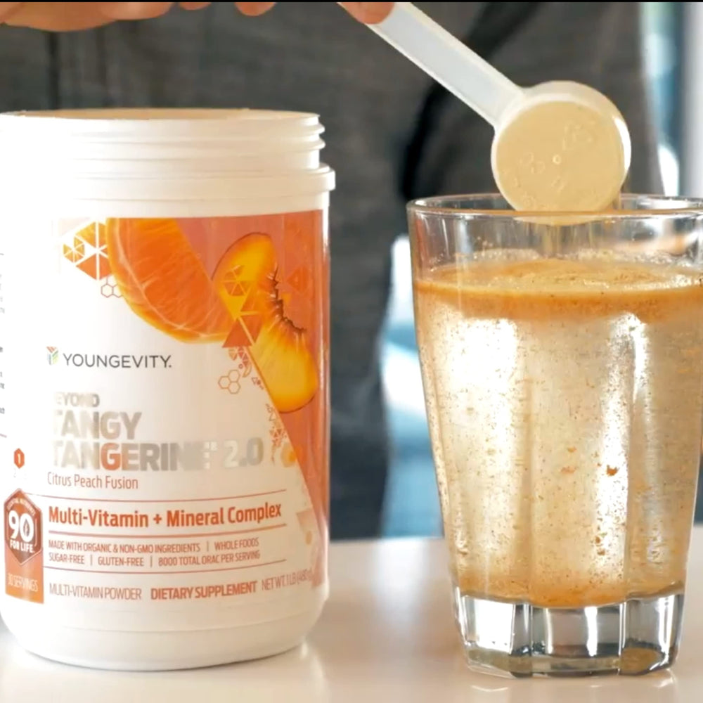 Youngevity BTT 2.0 powder with scoop ready to mix into your drink.
