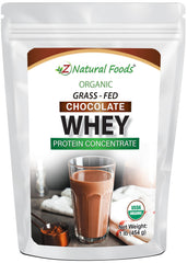 Z Natural Foods organic chocolate whey protein powder scoop beside glass of shake for recovery