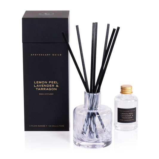 Zodax Apothecary Guild Opal Glass Diffuser bottle releasing Lemon Peel scent for bright rooms.