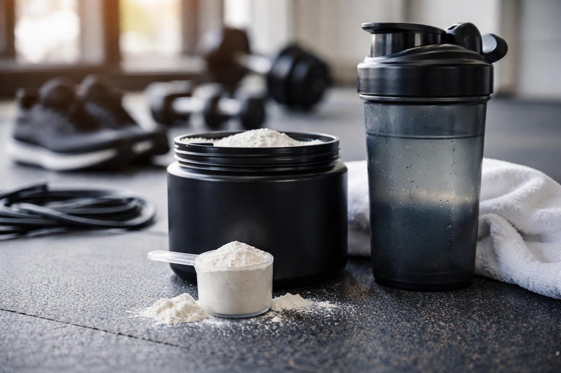 Amino acids powder scoop beside shaker after gym workout
