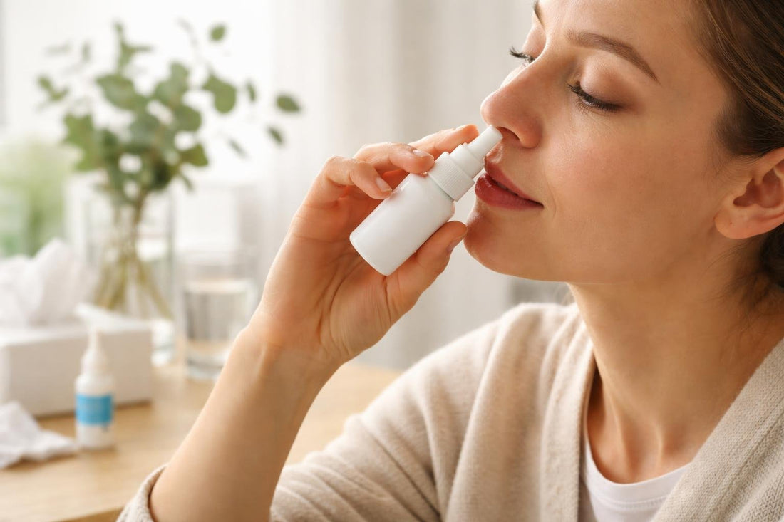 Person using nasal decongestant spray with correct angle