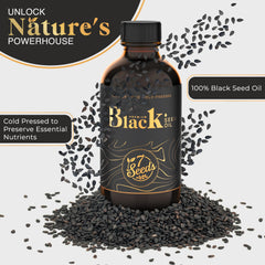 7 Seeds Black Seed Oil drops on spoon for easy daily use
