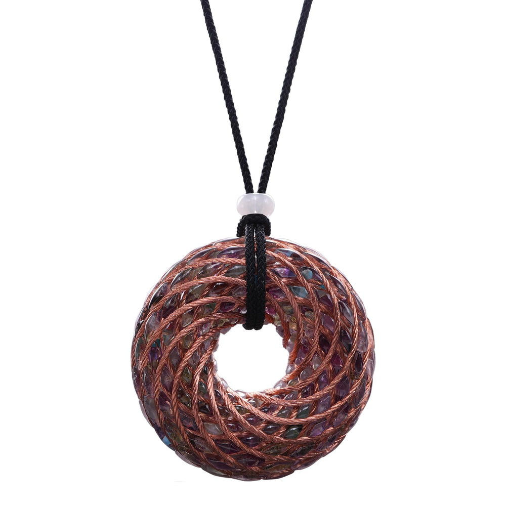 Abrakadoubra tensor rings pendant close-up showing copper double vortex for energy balance.