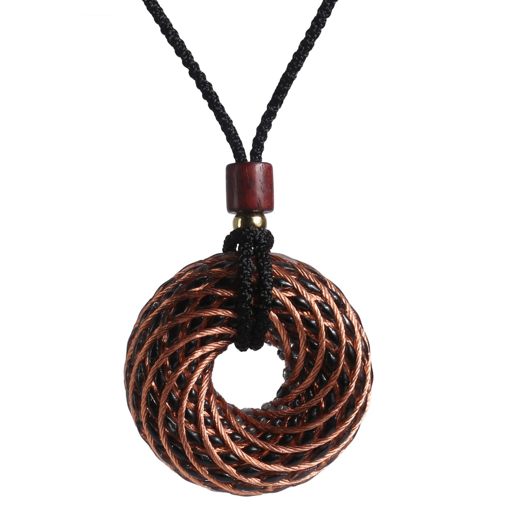 Abrakadoubra Tensor Rings copper pendant with double vortex for energy balance during meditation.