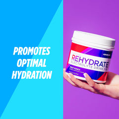 AdvoCare Rehydrate powder dissolves in water forming a bright Fruit Punch beverage.