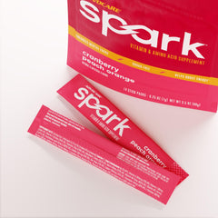 AdvoCare Spark Cranberry Peach Orange in glass highlighting refreshing flavor and immune support