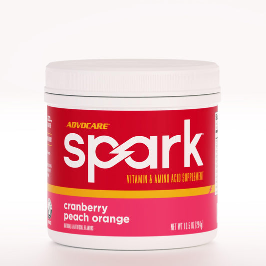 AdvoCare Spark cranberry-peach-orange tub for on-the-go energy and focus.