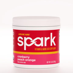 AdvoCare Spark cranberry-peach-orange tub for on-the-go energy and focus.