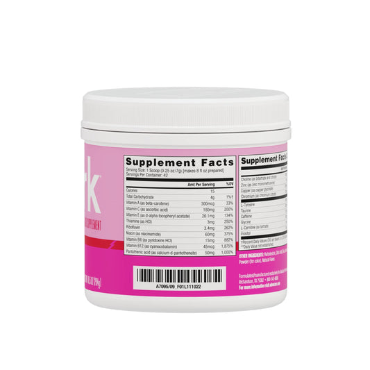 AdvoCare Spark pink lemonade powder dissolving smoothly in water.