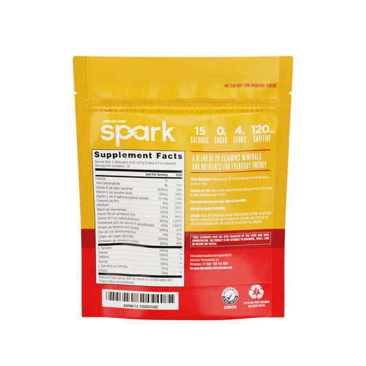 Advocare Spark stick pack beside laptop for focused study session